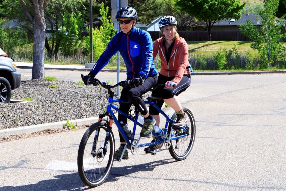 Alison and her rider on a tandem returning from a 25 mile ride   